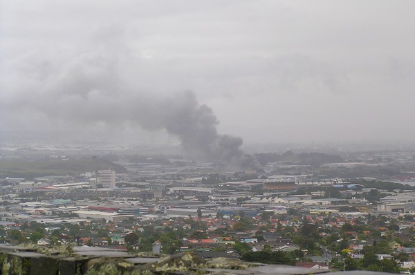 The smoke from a blaze at an abandoned freezing works in Penrose